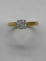 An 18ct yellow gold diamond solitaire ring, the four claw set round brilliant cut stone approx. 0.