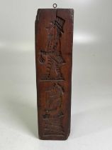 A 19th century wooden gingerbread mould featuring the profile of a gentleman wearing a hat and a