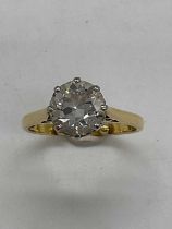 An 18ct yellow gold diamond solitaire ring, the eight claw set round brilliant cut stone approx.