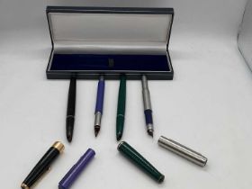 Four Parker pens (af)