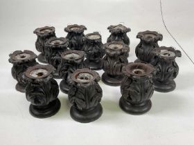A quantity of carved oak candlesticks, made from finials (13)