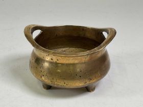 A Chinese brass incense burner, diameter 13cm.