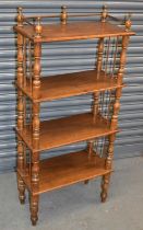 A Victorian style stained beech four tier whatnot on turned supports, width 56cm, height 125cm.