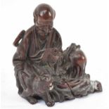 A Chinese carved rootwood figure, height 17cm.