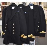 Three Royal Navy Officer's uniforms.
