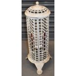 A French white painted cast iron stove/lamp, height 75cm.