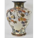 A large Japanese Satsuma baluster form vase, polychrome decorated with birds amongst flowering