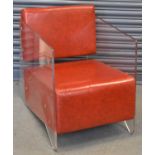 A stylish modern red leather and perspex enclosed chair, width 64cm.
