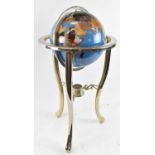 A polished specimen stone globe on chrome stand, height approx 90cm.