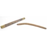 An Aboriginal stick/pole with painted decoration, length 60cm and a simple wooden boomerang, 67cm.