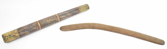An Aboriginal stick/pole with painted decoration, length 60cm and a simple wooden boomerang, 67cm.