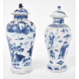 Two Chinese blue and white baluster form vases with covers, height of largest 22cm (both af).