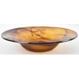 A large Art Glass amber coloured circular bowl, diameter 43cm.