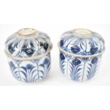 A pair of Chinese blue and white pots with covers (af). Condition Report: One cover has slight
