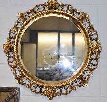 A gilt framed circular bevelled wall mirror, diameter 72cm.