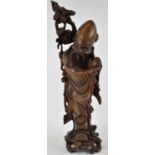 A Chinese rootwood carving of Shou Lao, height 58cm. Condition Report: Several cracks to the wood