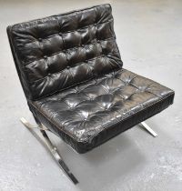 AFTER MIES VAN DER ROHE; a modern black buttoned leather Barcelona chair on chrome X-frame base.