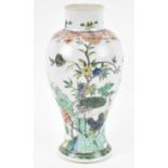 A 19th century Chinese porcelain vase decorated with bird amongst foliage, six character mark to