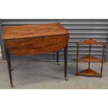 An early 19th century mahogany Pembroke table with end drawer on square tapering supports with brass