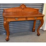 A Victorian oak two drawer hall table on substantial cabriole supports, width 137cm.