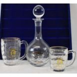 A modern Art Glass decanter and two royal commemorative glass mugs. (3)