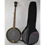 A Countryman Pro banjo, with soft case. Condition Report: His banjo appears in good condition, the
