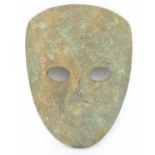 An Eastern/Islamic bronze mask, 14.5 x 11cm.