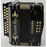 A Hohner Double-Ray accordion.