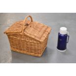 A wicker picnic basket.