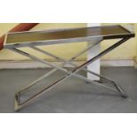 A modern chrome X-frame consol table with inset leather top, length 125cm, width 40cm.