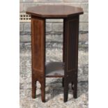 A small Edwardian inlaid mahogany octagonal two tier occasional table, diameter 30.5cm.