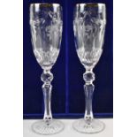 WATERFORD; a pair of Millenium commemorative champagne glasses, etched 2000 to the base, height 26.