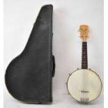 A 20th century ukulele banjo with brass back, cased.