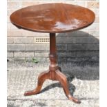 A 19th century mahogany circular tilt-top table on turned column and tripod supports, diameter 72cm.