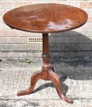 A 19th century mahogany circular tilt-top table on turned column and tripod supports, diameter 72cm.