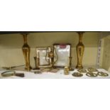 A small quantity of brassware to include two brass picture frames, five horse brasses and pair of