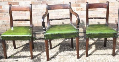 A 19th century mahogany open arm elbow chair and a matching pair of dining chairs on square supports