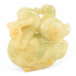 A Chinese carved green hardstone figure of two birds, height 5cm.