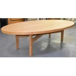 A very large modern oak oval dining table, 295 x 160cm.