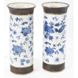 A pair of Chinese blue and white crackle glazed vases, height 20.5cm (both af).