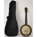 An early 20th century eight string mandolin banjo with walnut back.