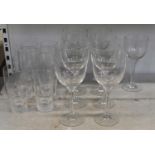 A set of eight crystal tumblers with matching set of nine large wine glasses. Condition Report:
