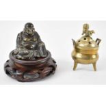 A small Chinese brass seated Buddha, height 8cm with associated stand, also a small brass censer,