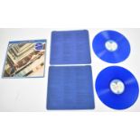 A Beatles 1967-1970 blue vinyl record with blue lyric inners and sleeve from 1978.