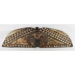 TRIBAL ART; a carved wooden Mou Shield, length 112cm.