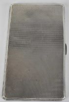 E J TREVITT & SONS LTD; a George V hallmarked silver cigarette case, Chester 1933, approx. 6.78ozt/