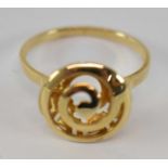 A 14ct yellow gold ring with swirl effect to front, size P, approx. 2.8g.