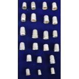 A collection of approximately twenty one silver thimbles, the majority hallmarked.