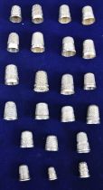 A collection of approximately twenty one silver thimbles, the majority hallmarked.