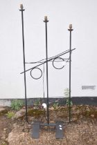 A contemporary wrought metal three-light standard lamp, height at tallest approx. 145cm.